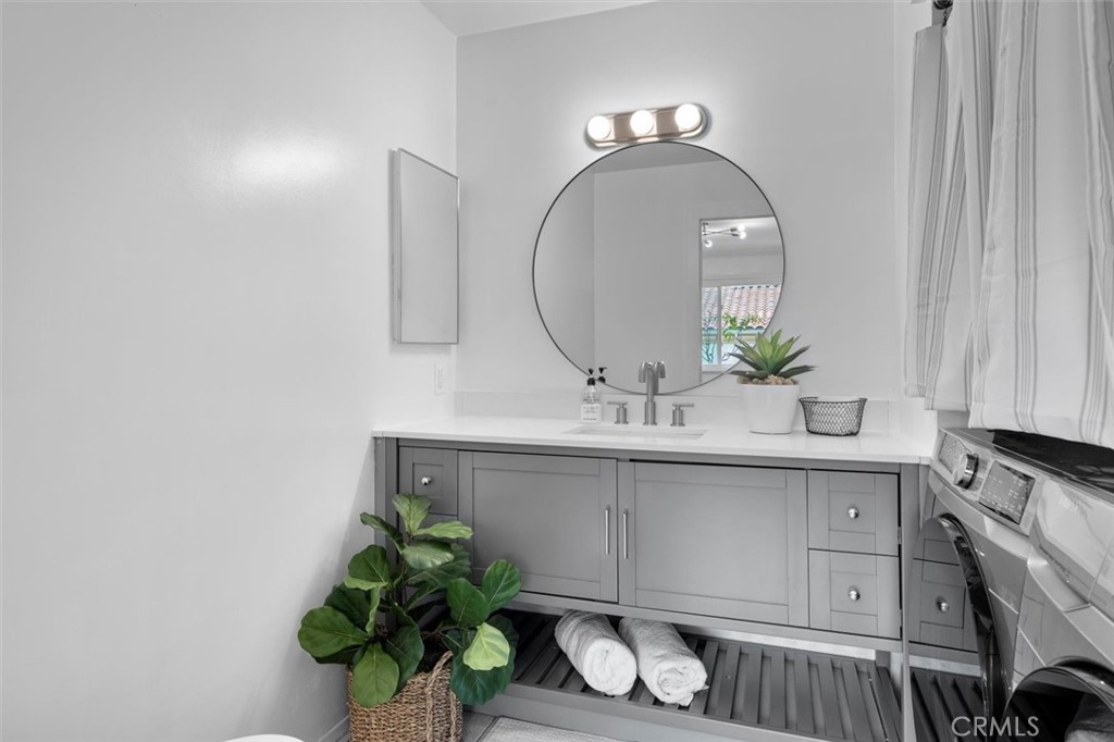 1200 Opal Street, Unit 7 Redondo Beach, CA 90277 - Photo 17 of 40 a bathroom with a sink and a mirror