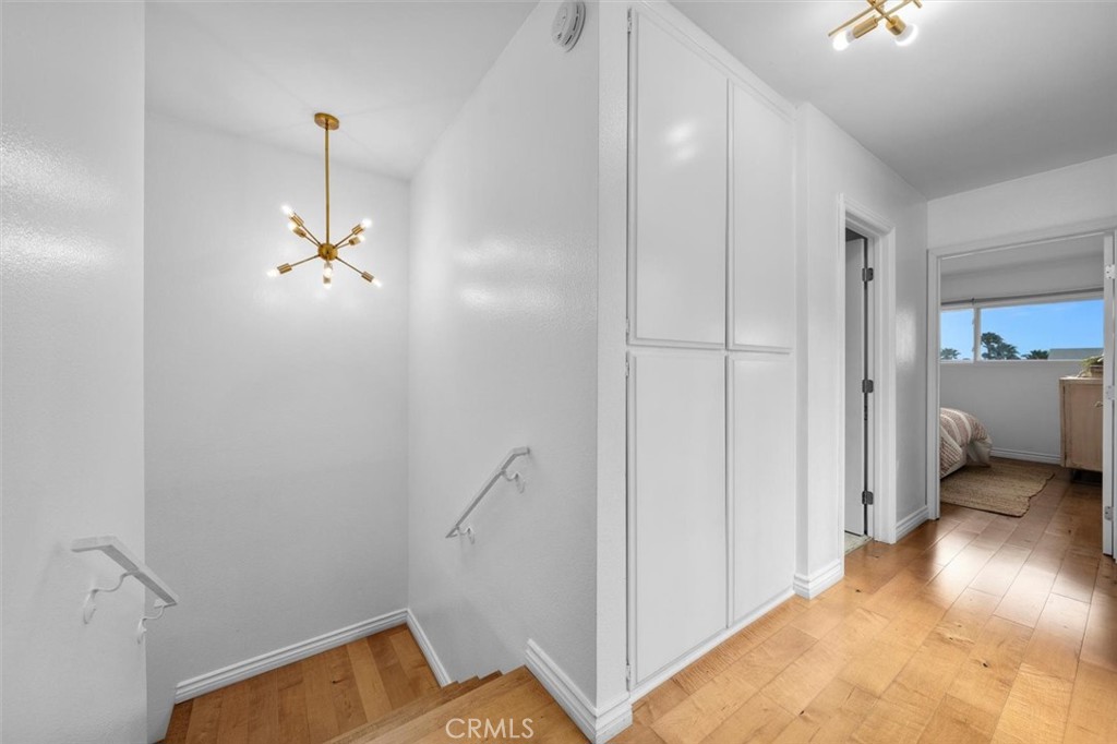 1200 Opal Street, Unit 7 Redondo Beach, CA 90277 - Photo 19 of 40 a view of a livingroom with a hall and a ceiling fan