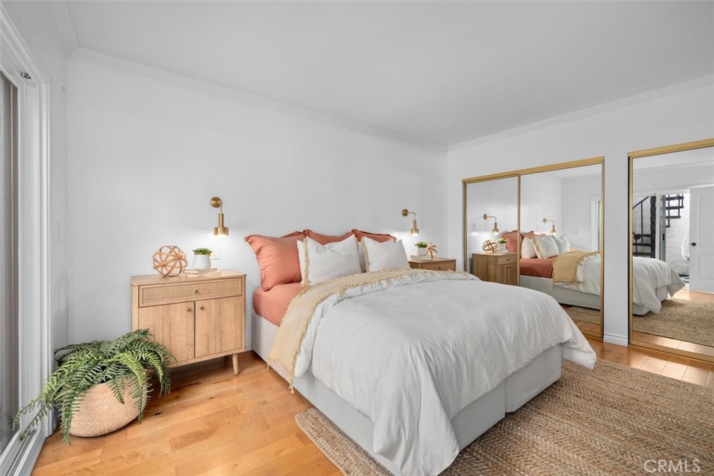 1200 Opal Street, Unit 7 Redondo Beach, CA 90277 - Photo 20 of 40 a bedroom with bed and wooden floor