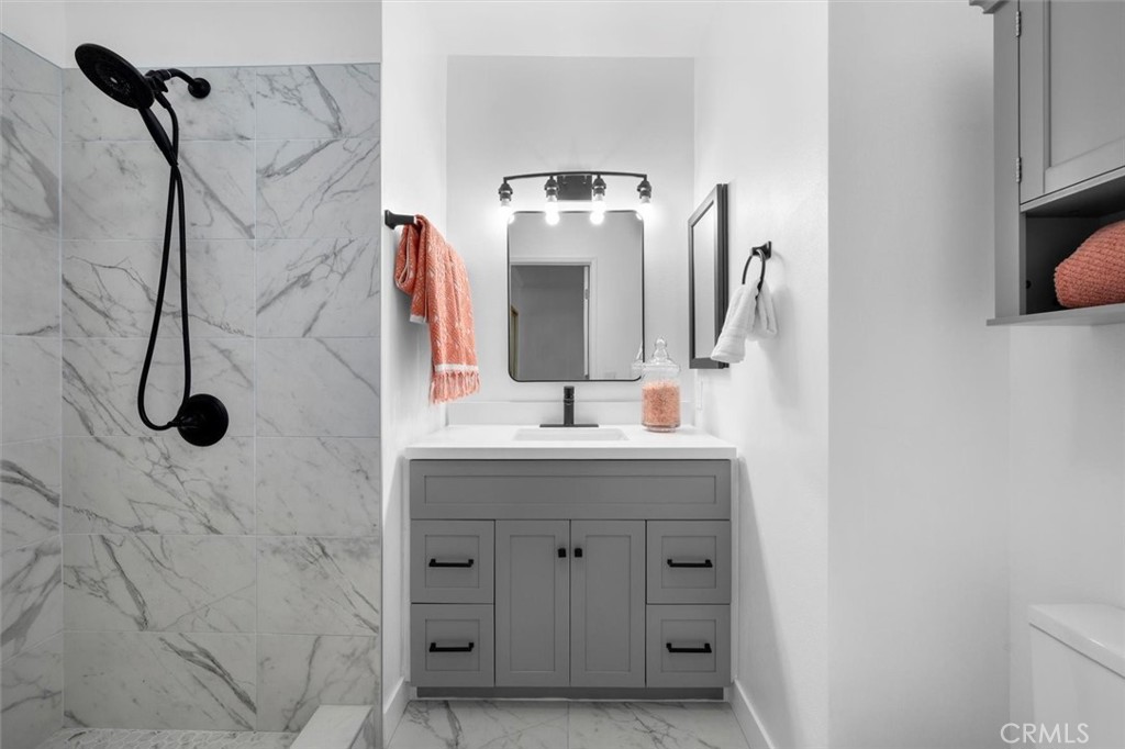 1200 Opal Street, Unit 7 Redondo Beach, CA 90277 - Photo 22 of 40 a bathroom with a sink and a mirror