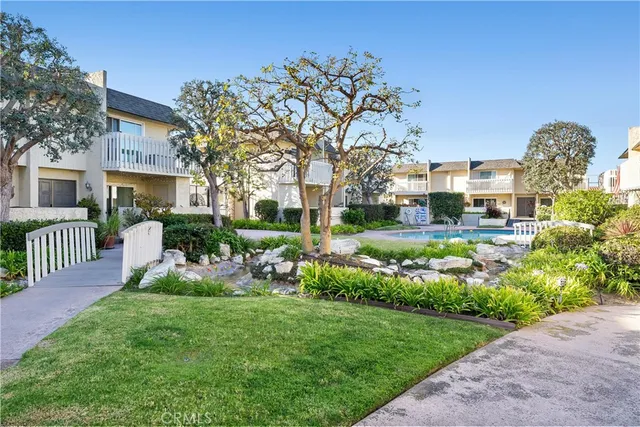 a view of a backyard with sitting area