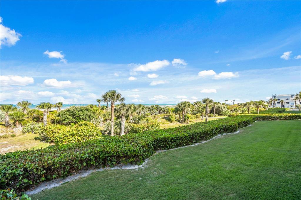 8700 Ridgewood Avenue, Unit 204B Cape Canaveral, FL 32920 - Photo 9 of 10 a view of a lake with a big yard