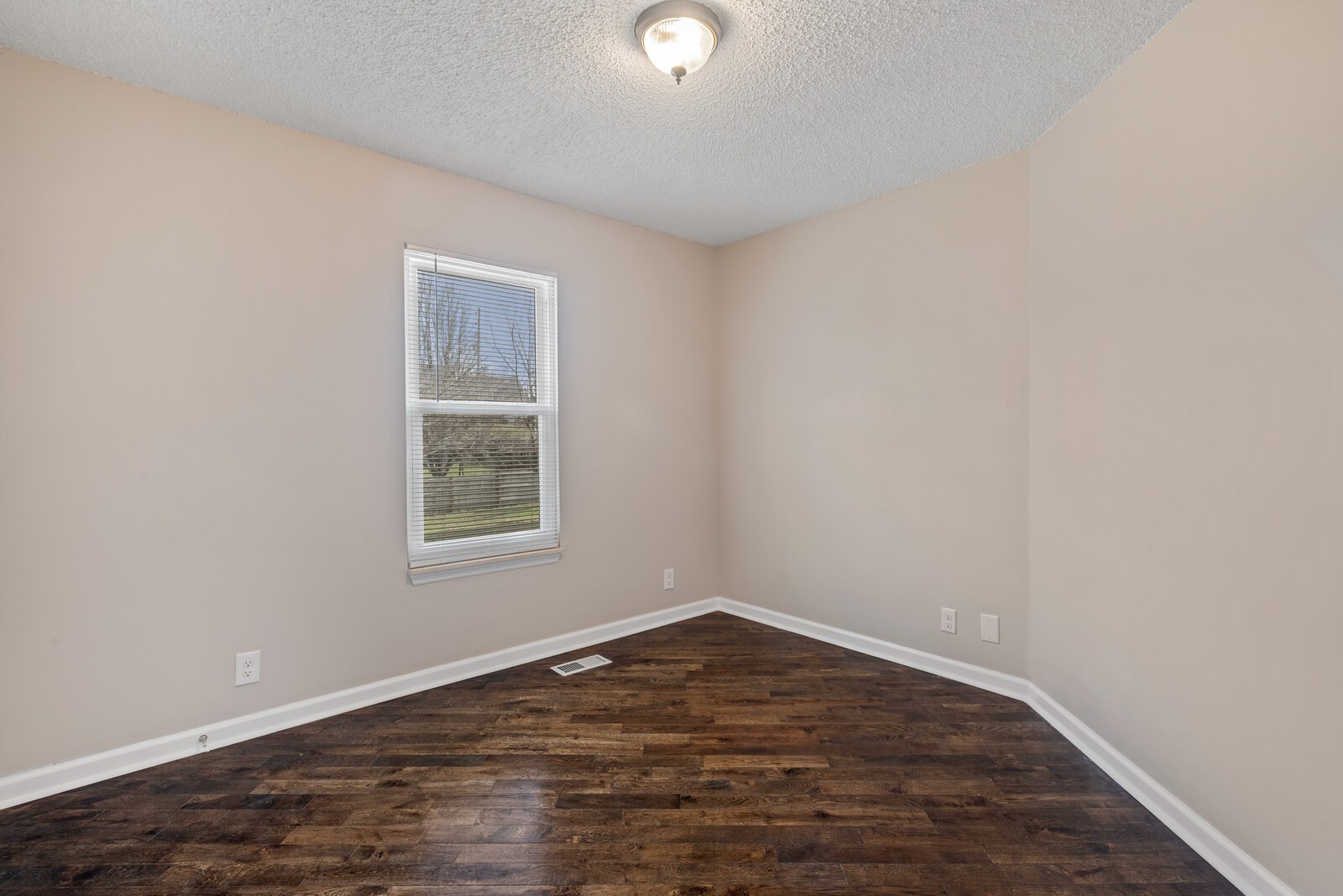 1617 Alsdale Road Mount Juliet, TN 37122 - Photo 20 of 34 an empty room with wooden floor and windows