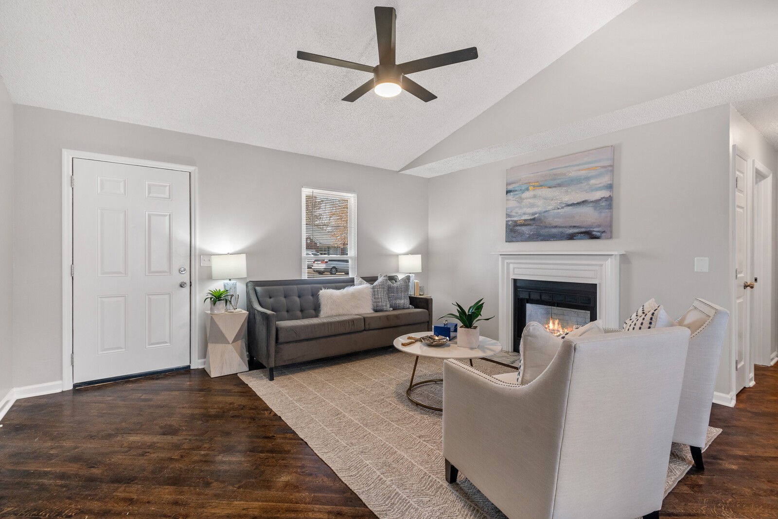 1617 Alsdale Road Mount Juliet, TN 37122 - Photo 5 of 34 a living room with furniture a fireplace and a table