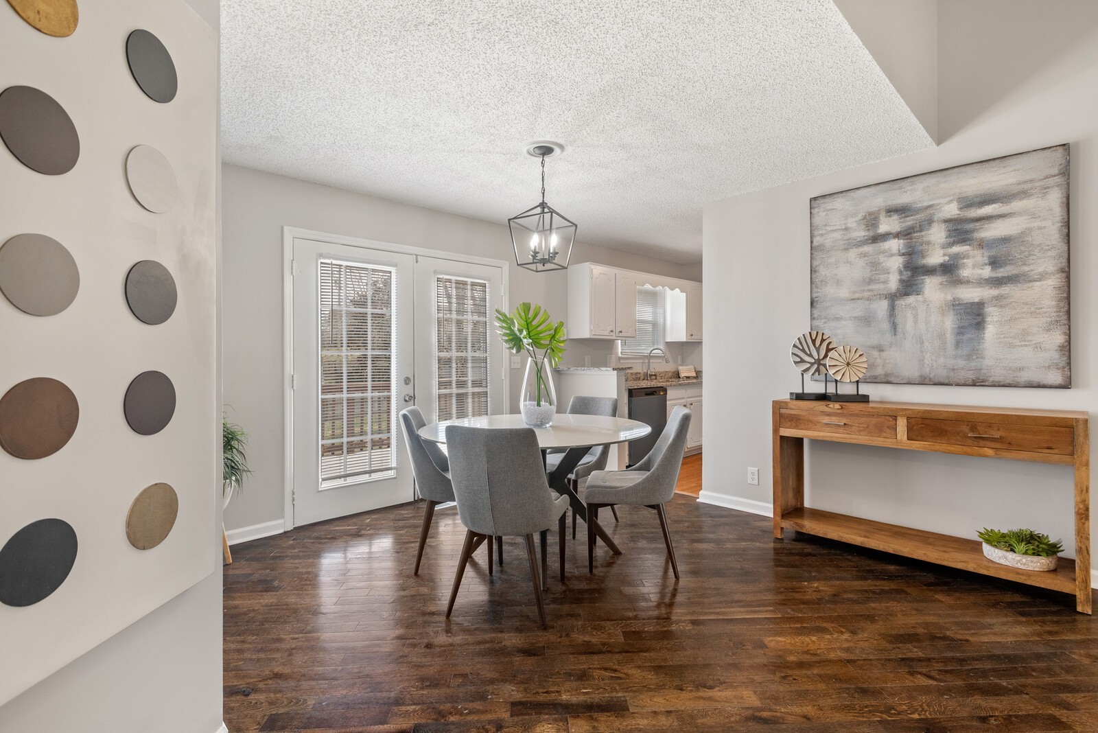 1617 Alsdale Road Mount Juliet, TN 37122 - Photo 7 of 34 a dining room with furniture a chandelier and wooden floor