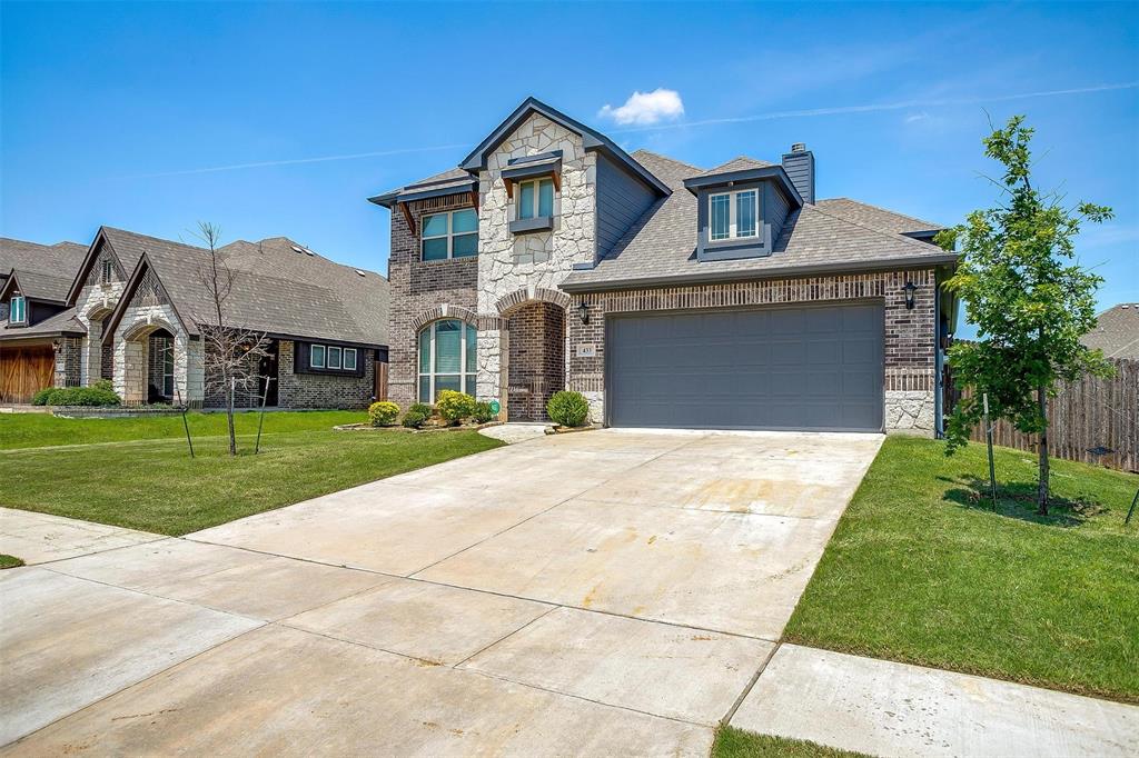 433 Joseph Lane Crowley, TX 76036 - Photo 1 of 40 a front view of a house with a garden