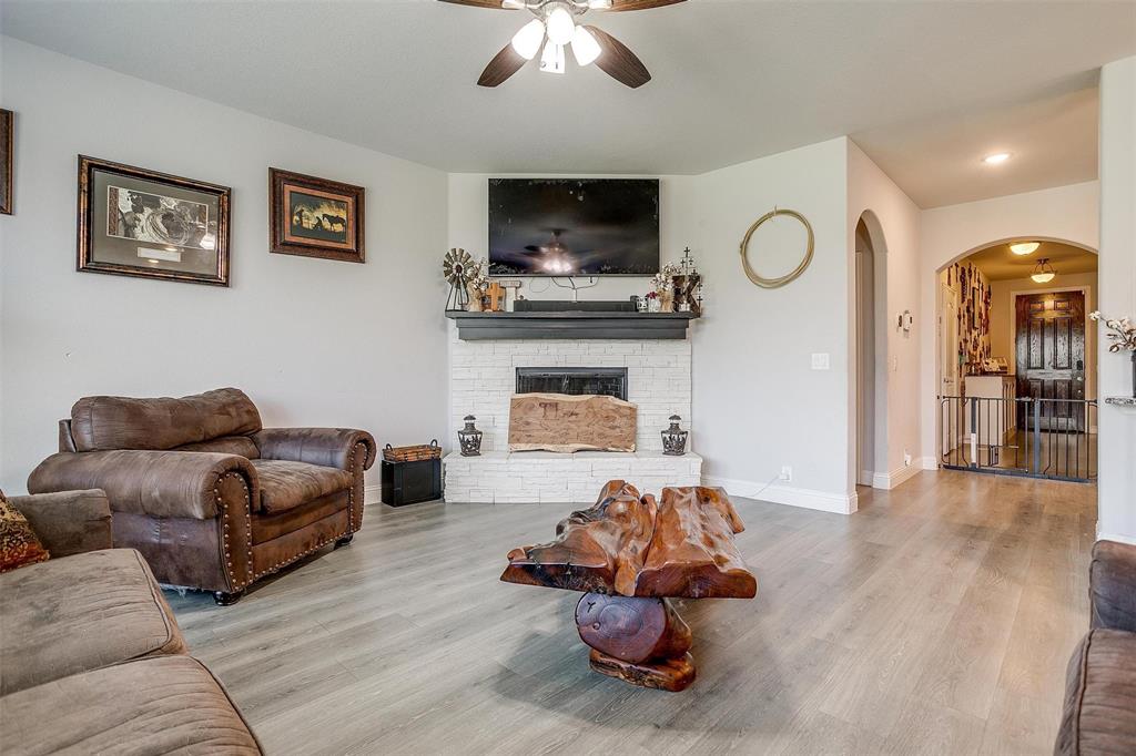 433 Joseph Lane Crowley, TX 76036 - Photo 19 of 40 a living room with furniture and a flat screen tv