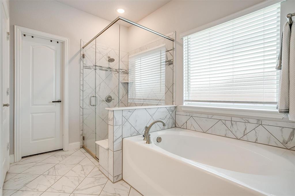 433 Joseph Lane Crowley, TX 76036 - Photo 25 of 40 a bathroom with a bathtub and shower