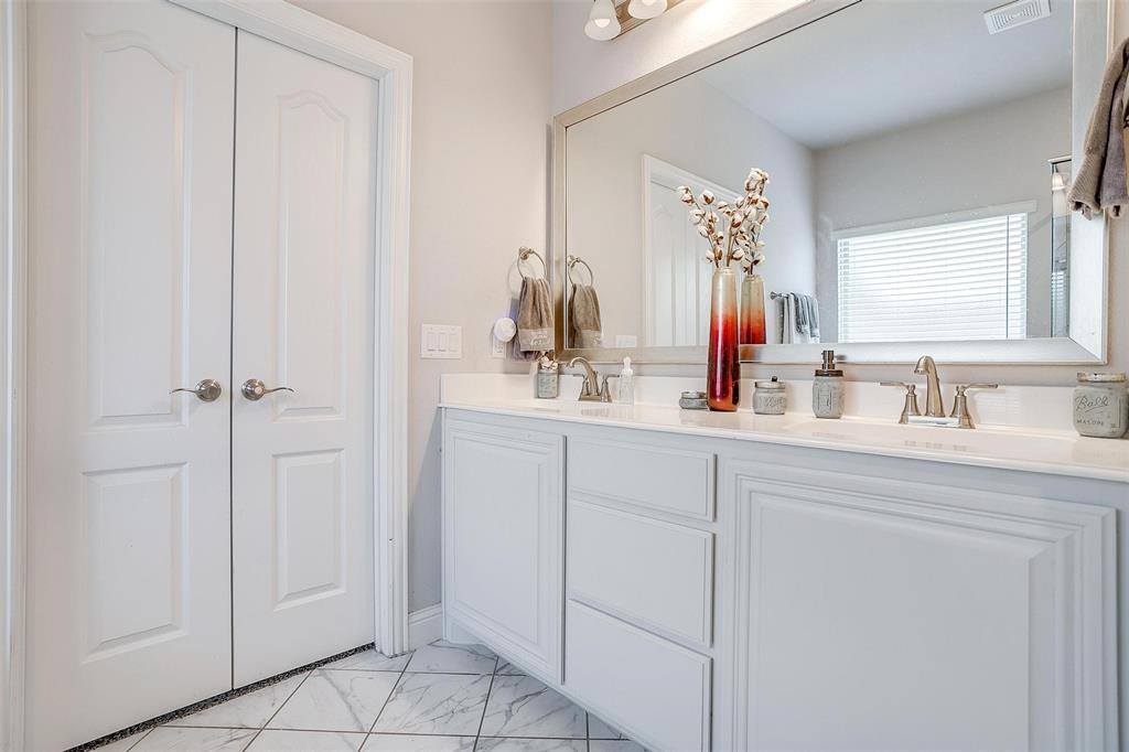 433 Joseph Lane Crowley, TX 76036 - Photo 27 of 40 a bathroom with a double vanity sink and a mirror