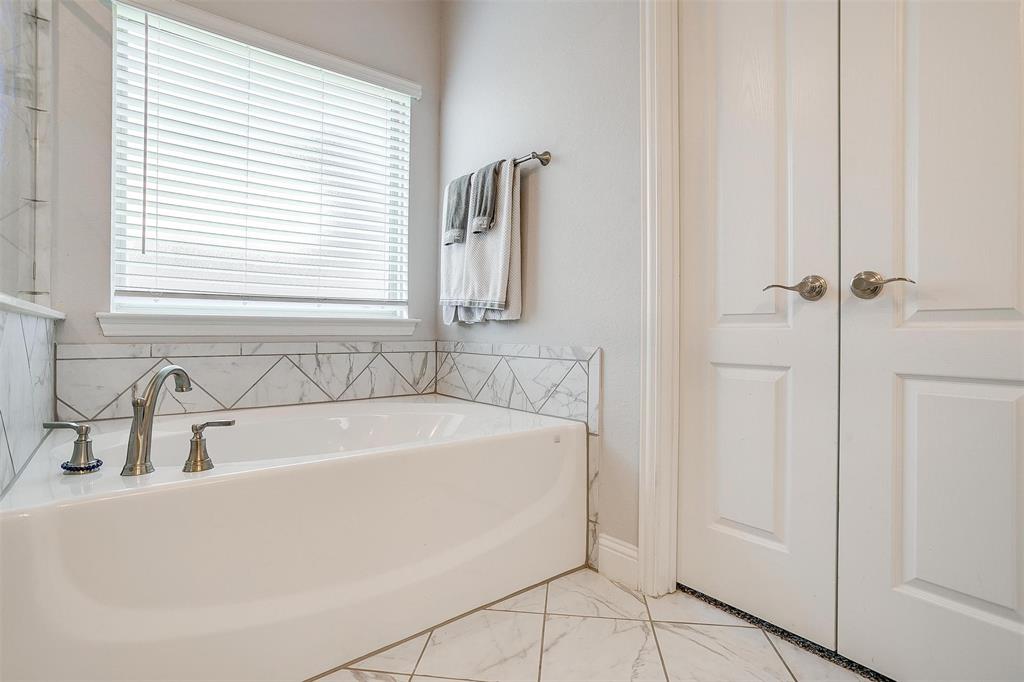 433 Joseph Lane Crowley, TX 76036 - Photo 28 of 40 a white bath tub sitting next to a window