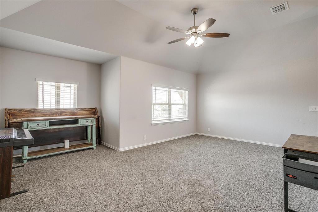 433 Joseph Lane Crowley, TX 76036 - Photo 31 of 40 a living room with furniture and a ceiling fan