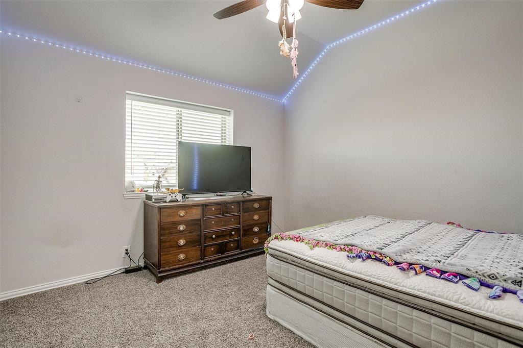 433 Joseph Lane Crowley, TX 76036 - Photo 34 of 40 a bedroom with a bed and a flat screen tv