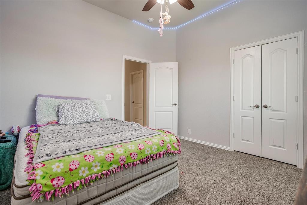 433 Joseph Lane Crowley, TX 76036 - Photo 36 of 40 a bedroom with a bed and a baby crib
