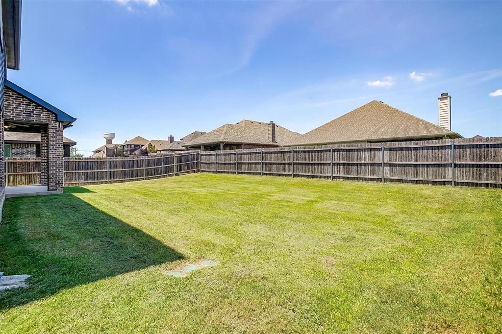 433 Joseph Lane Crowley, TX 76036 - Photo 40 of 40 a view of a large pool with a lawn chairs under an umbrella