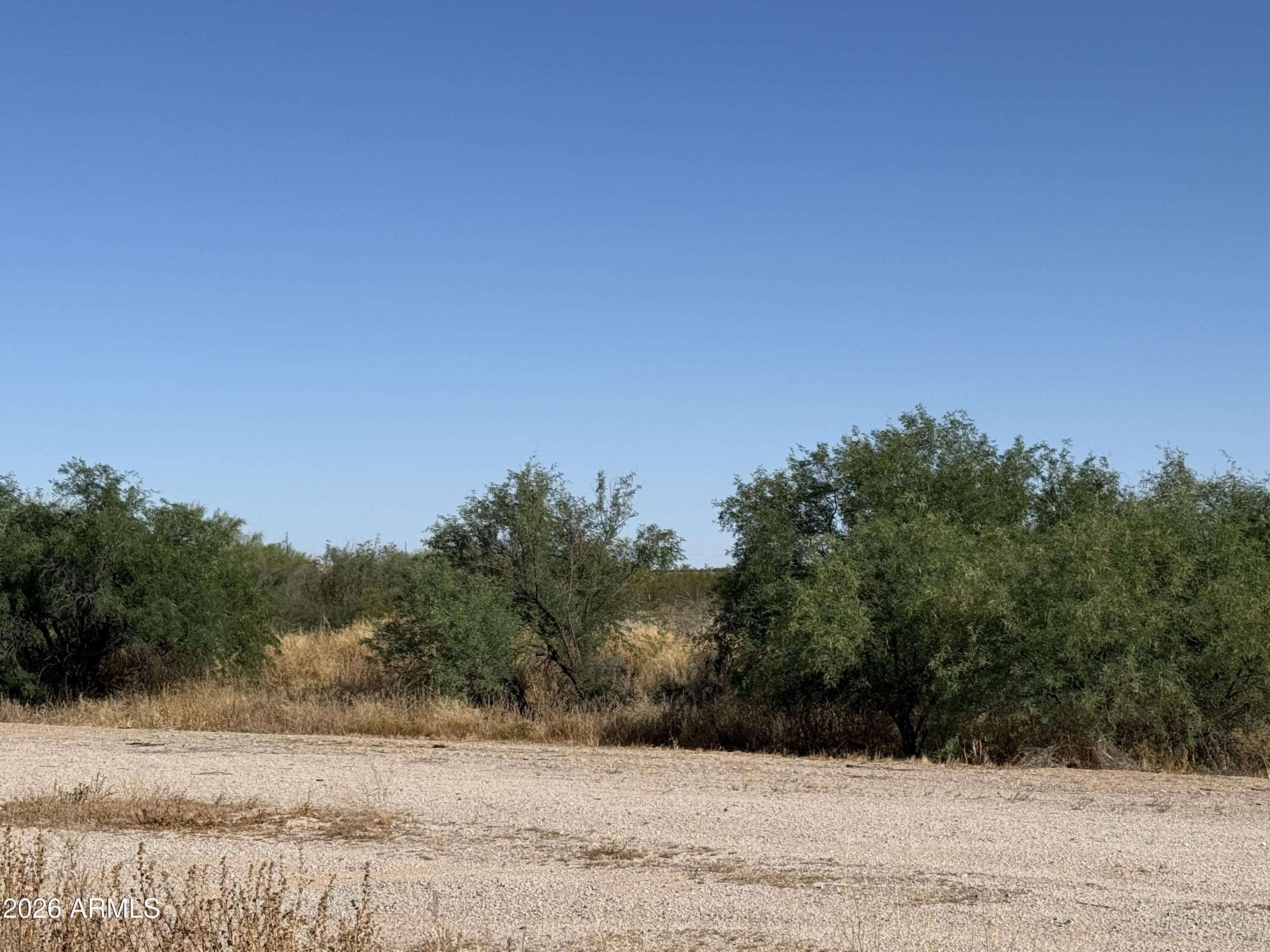 17403 West Baseline Road Buckeye, AZ 85326 - Photo 2 of 3 a view of a yard with a house