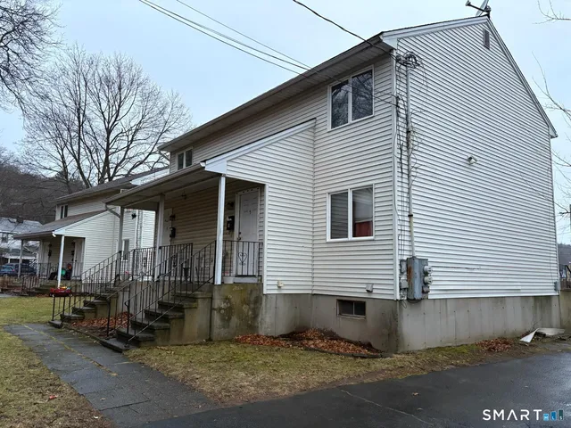 a front view of a house with garage