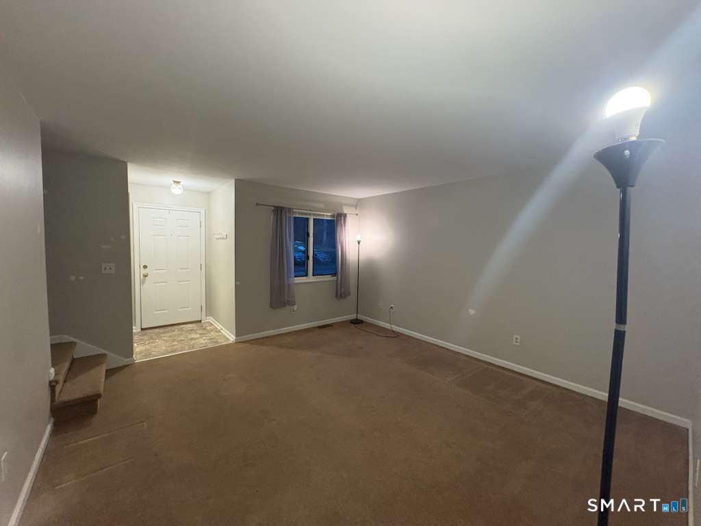 11 Park Road Hamden, CT 06517 - Photo 4 of 12 an empty room with windows