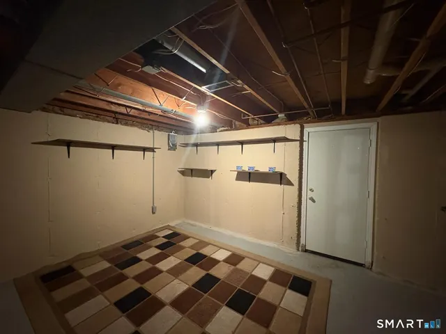 a view of a room with wooden floor