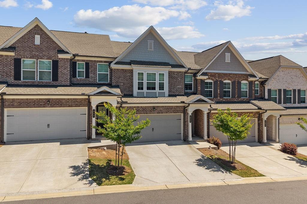 922 Edwin Lane Sugar Hill, GA 30518 - Photo 2 of 43 a front view of a house with garden