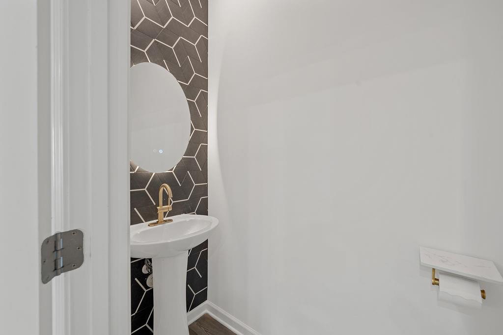 922 Edwin Lane Sugar Hill, GA 30518 - Photo 21 of 43 a bathroom with a sink and a mirror