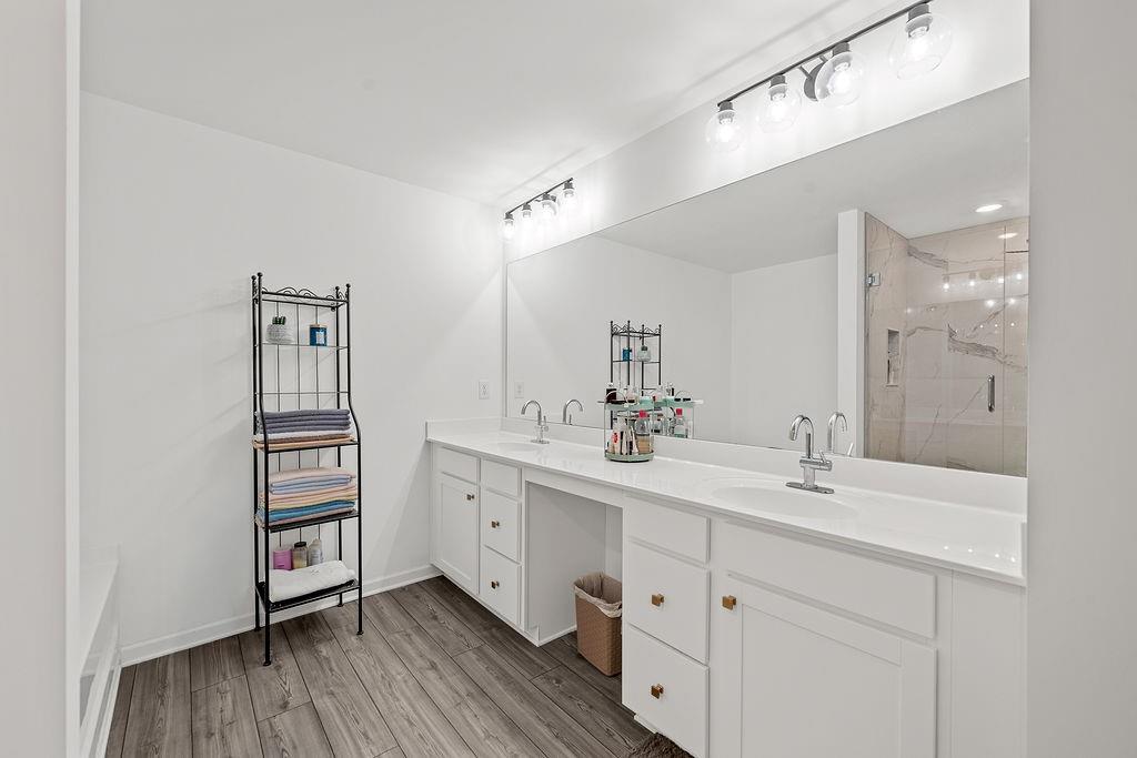 922 Edwin Lane Sugar Hill, GA 30518 - Photo 28 of 43 a spacious bathroom with a double vanity sink and a mirror