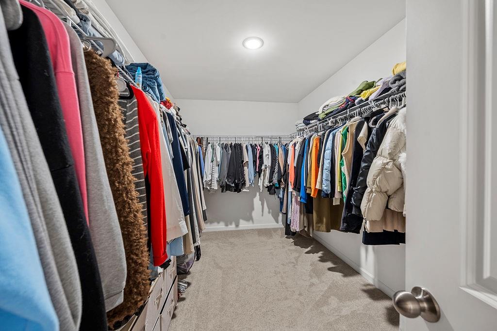 922 Edwin Lane Sugar Hill, GA 30518 - Photo 31 of 43 a view of walk in closet with clothes
