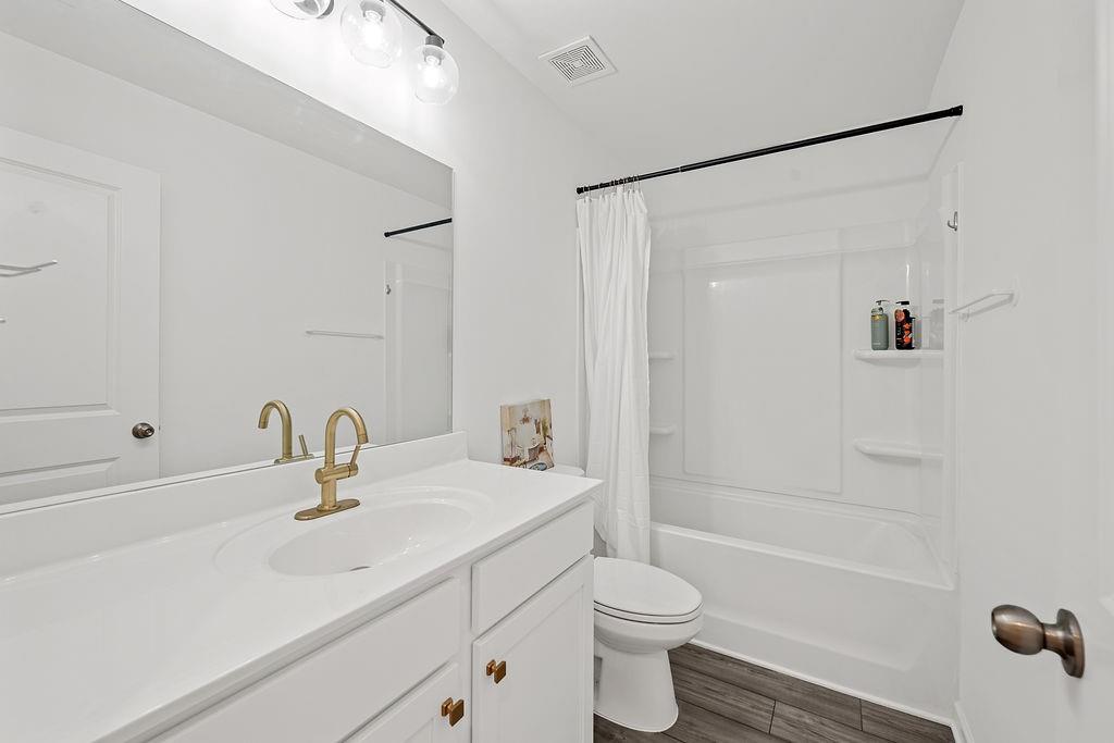922 Edwin Lane Sugar Hill, GA 30518 - Photo 38 of 43 a bathroom with a sink mirror toilet and bathtub