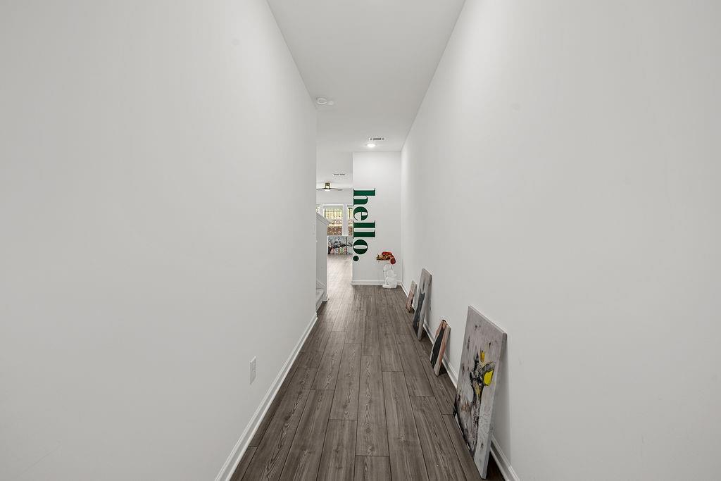922 Edwin Lane Sugar Hill, GA 30518 - Photo 4 of 43 a view of a hallway with wooden floor and staircase