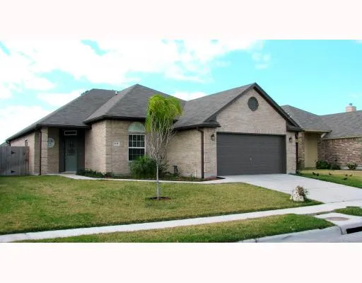 a house view with a garden space