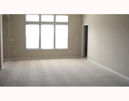 a black and white photo of a living room