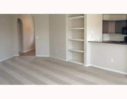 a black and white photo of a living room