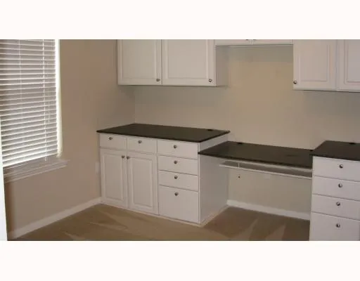 a open hall with a open kitchen view