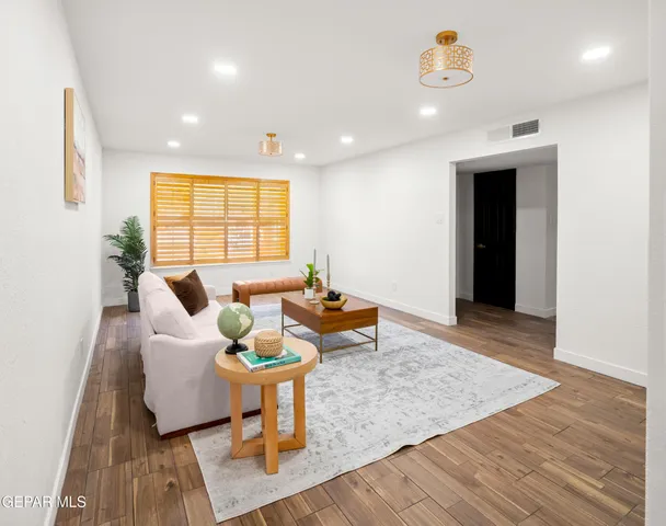 a living room with furniture and a couch