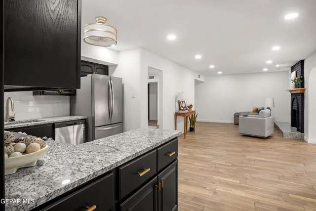 an empty room with a painting on the wall