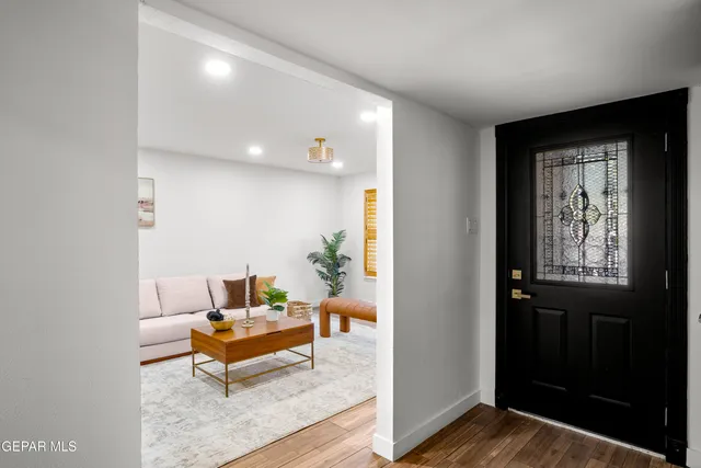 a living room with furniture and window