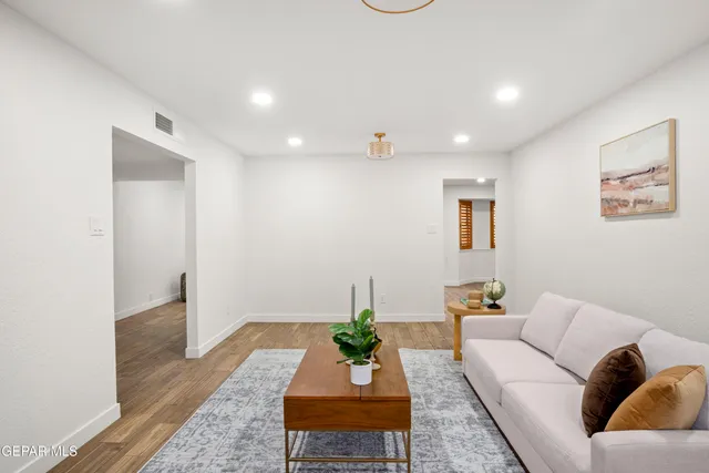 a kitchen with stainless steel appliances granite countertop a sink refrigerator and cabinets