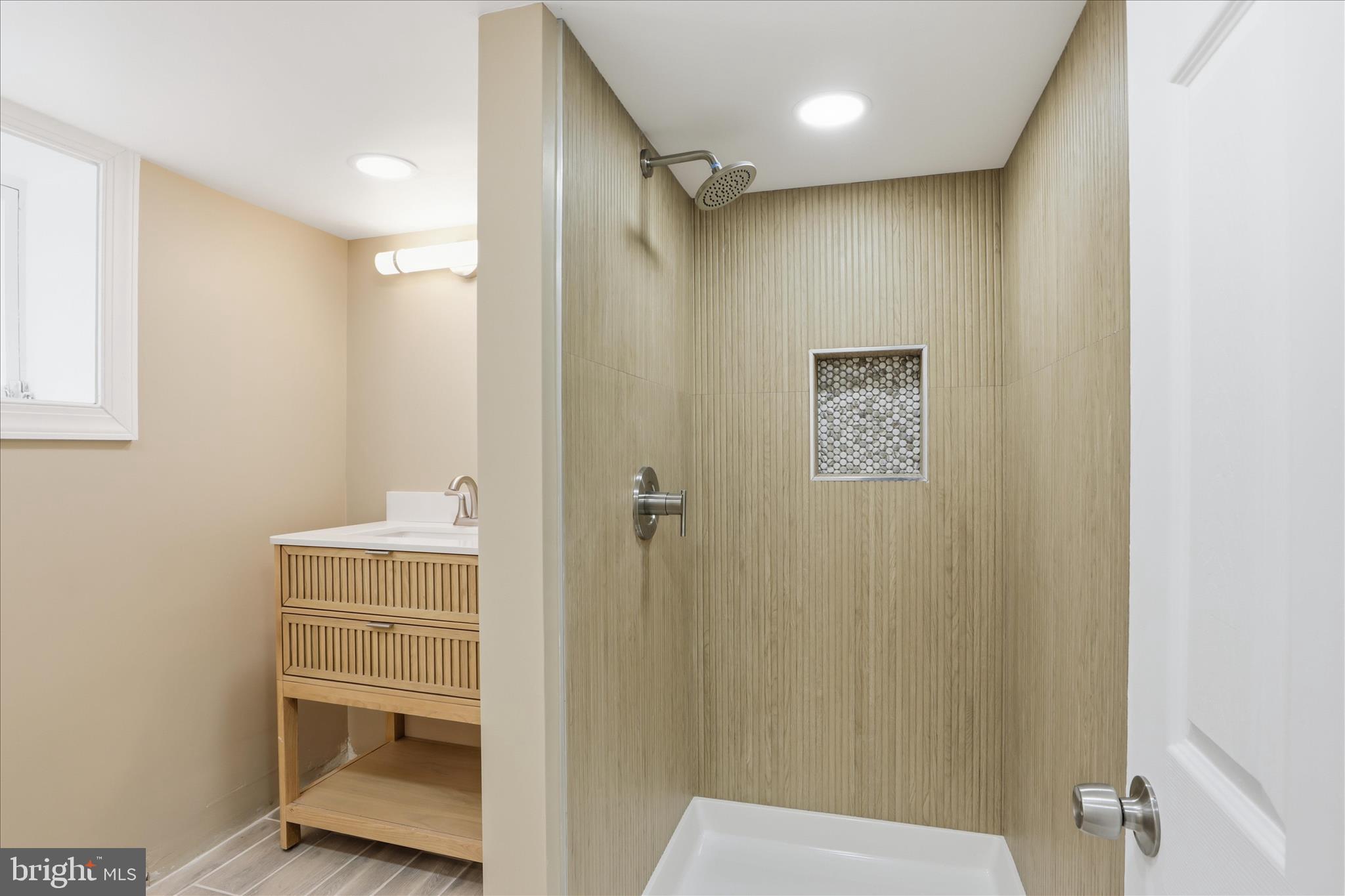 3801 West Overlea Avenue Baltimore, MD 21206 - Photo 13 of 29 a bathroom with a shower and a sink