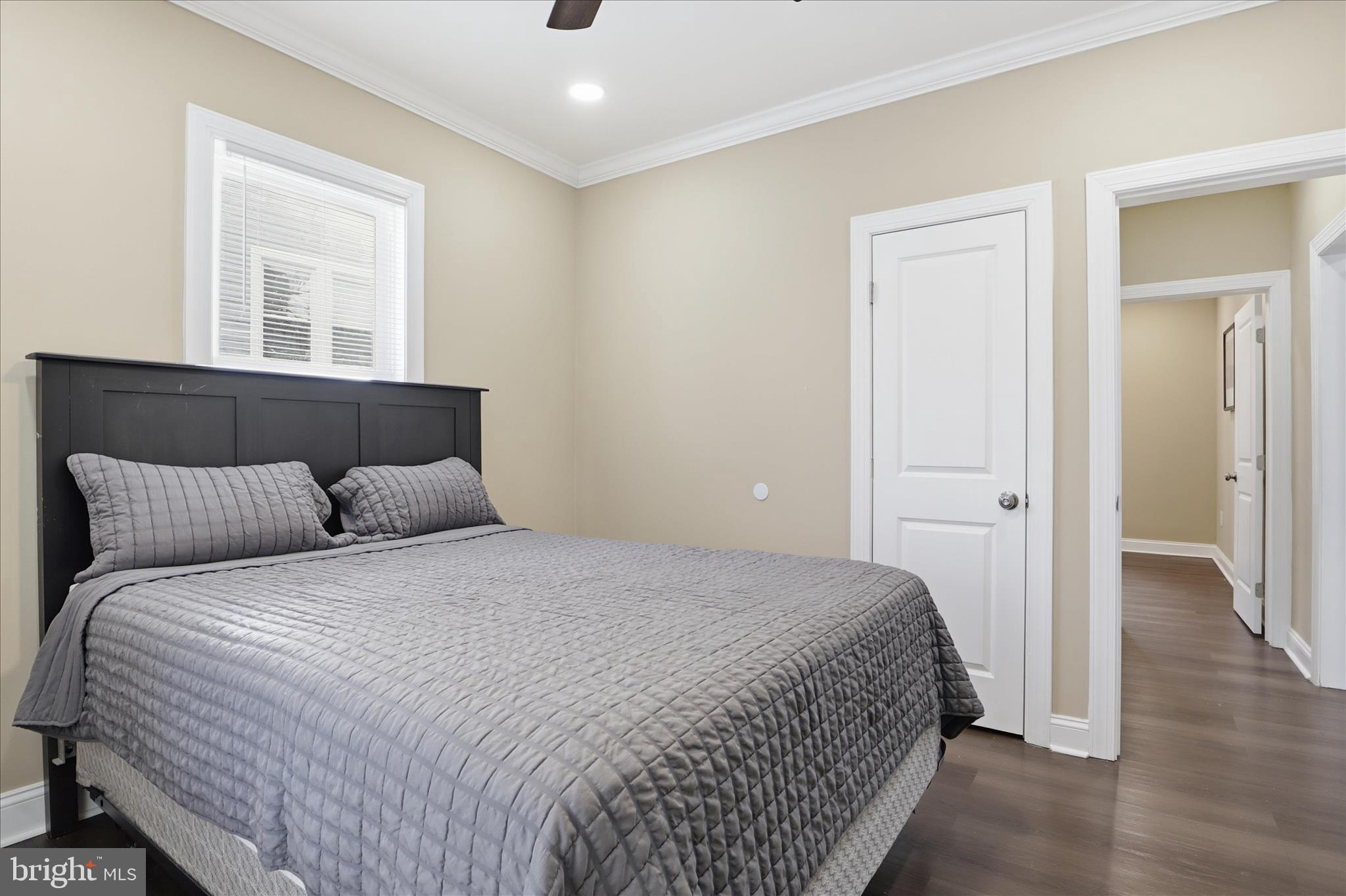 3801 West Overlea Avenue Baltimore, MD 21206 - Photo 7 of 29 a bedroom with a bed and wooden floor