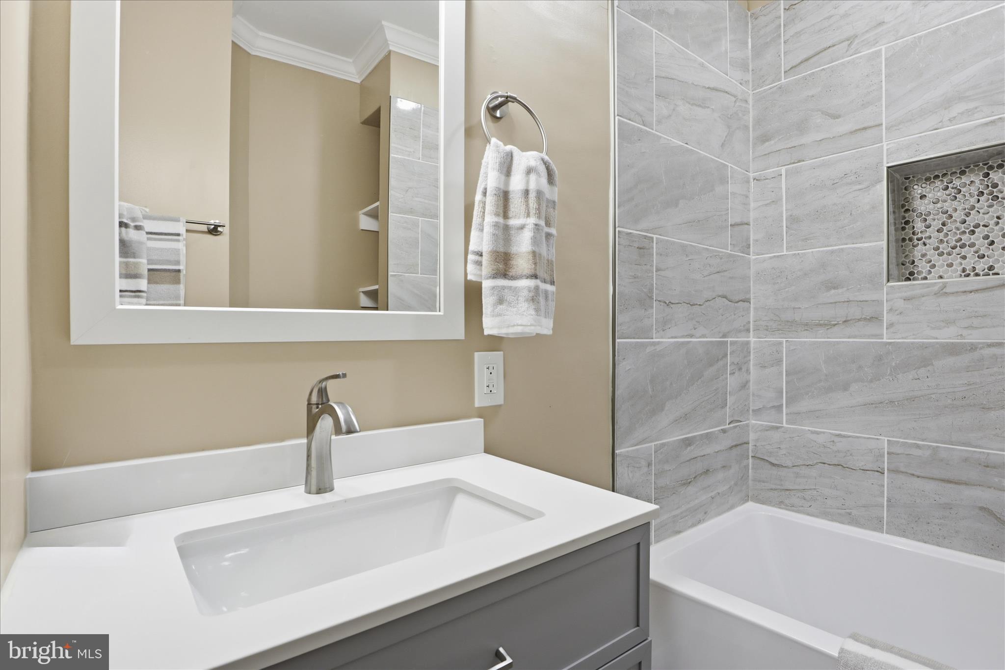 3801 West Overlea Avenue Baltimore, MD 21206 - Photo 8 of 29 a bathroom with a sink and a mirror