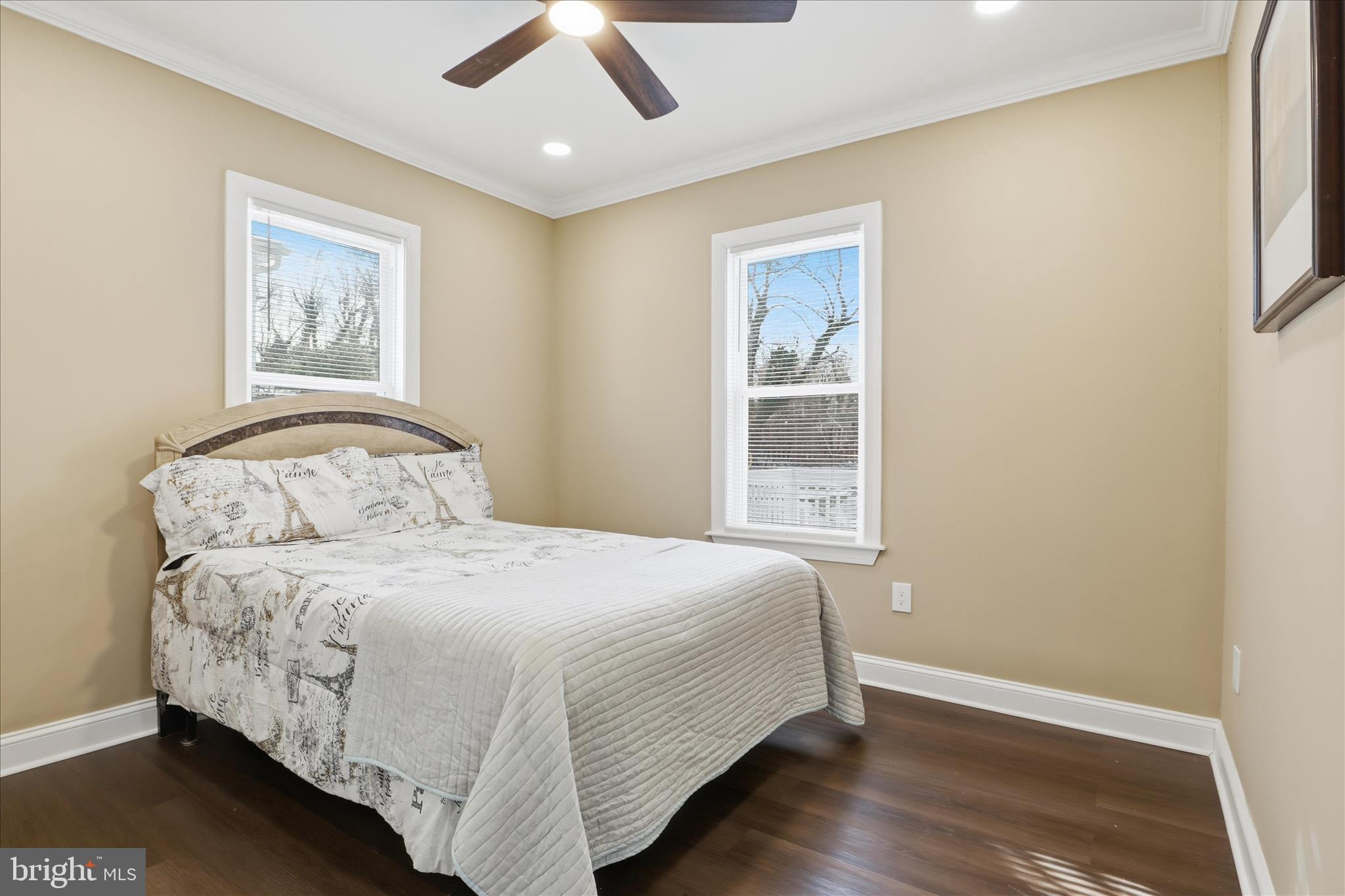 3801 West Overlea Avenue Baltimore, MD 21206 - Photo 10 of 29 a bedroom with a bed and wooden floor