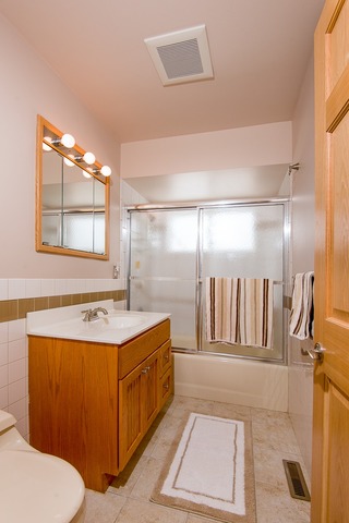 1165 Oxford Road Deerfield, IL 60015 - Photo 12 of 16 a bathroom with a sink mirror vanity and toilet