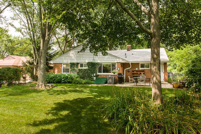 1165 Oxford Road Deerfield, IL 60015 - Photo 16 of 16 a front view of a house with swimming pool having outdoor seating