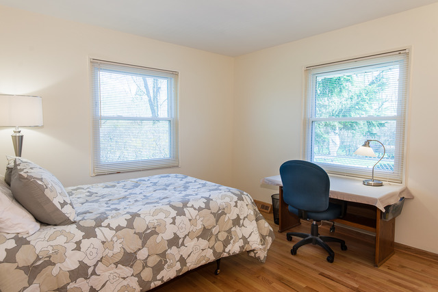 1165 Oxford Road Deerfield, IL 60015 - Photo 8 of 16 a bedroom with a bed chair and a window