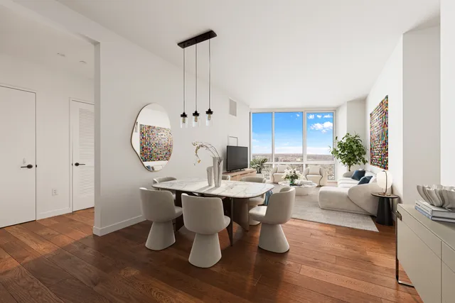 a view of a dining room with furniture window and wooden floor
