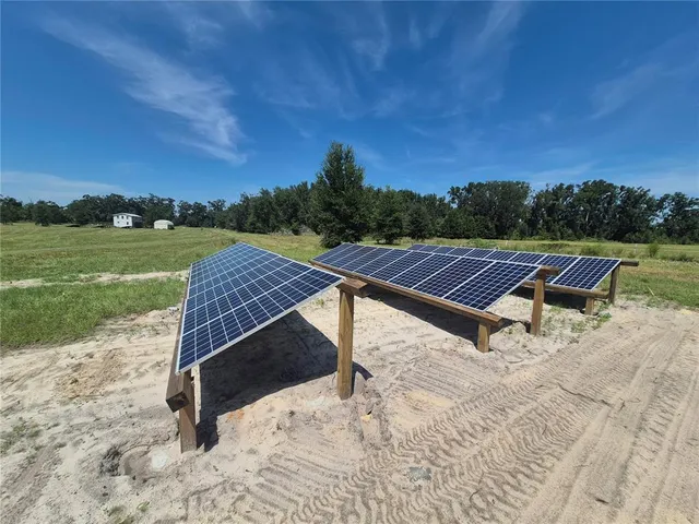 a view of sitting area with swimming pool and mountains
