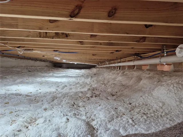 a view of a garage with wooden floor