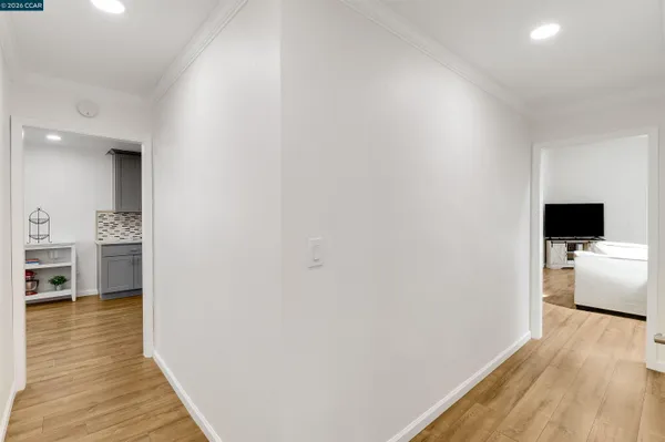 a view of a living room with wooden floor