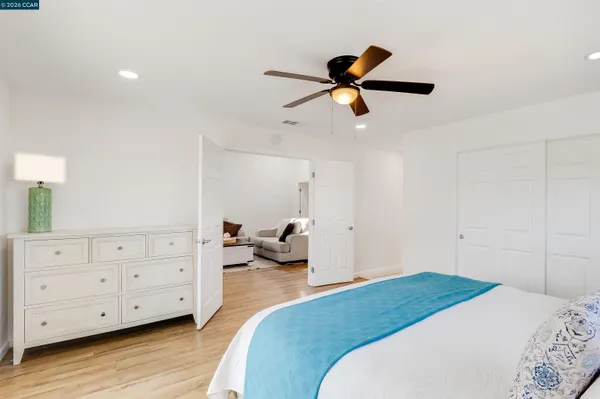 a bedroom with a bed and a dresser