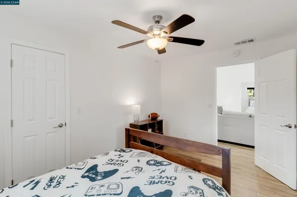 a bedroom with a bed and a dresser