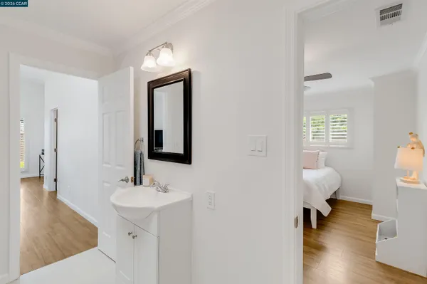 a bathroom with a sink vanity and a mirror